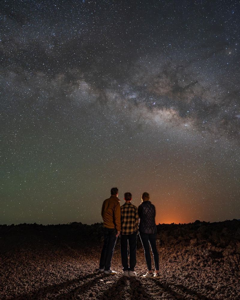 Group of stargazers beneath the Milky Way on Mauna Kea